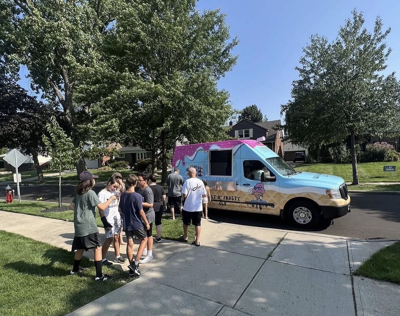 Teens lining up for the truck in the neighborhood